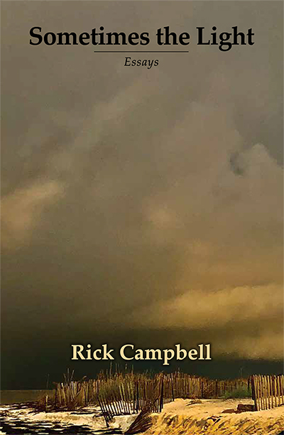 Sometimes the Light, Essays by Rick Campbell shows a beach dramatically lit as a storm rolls in